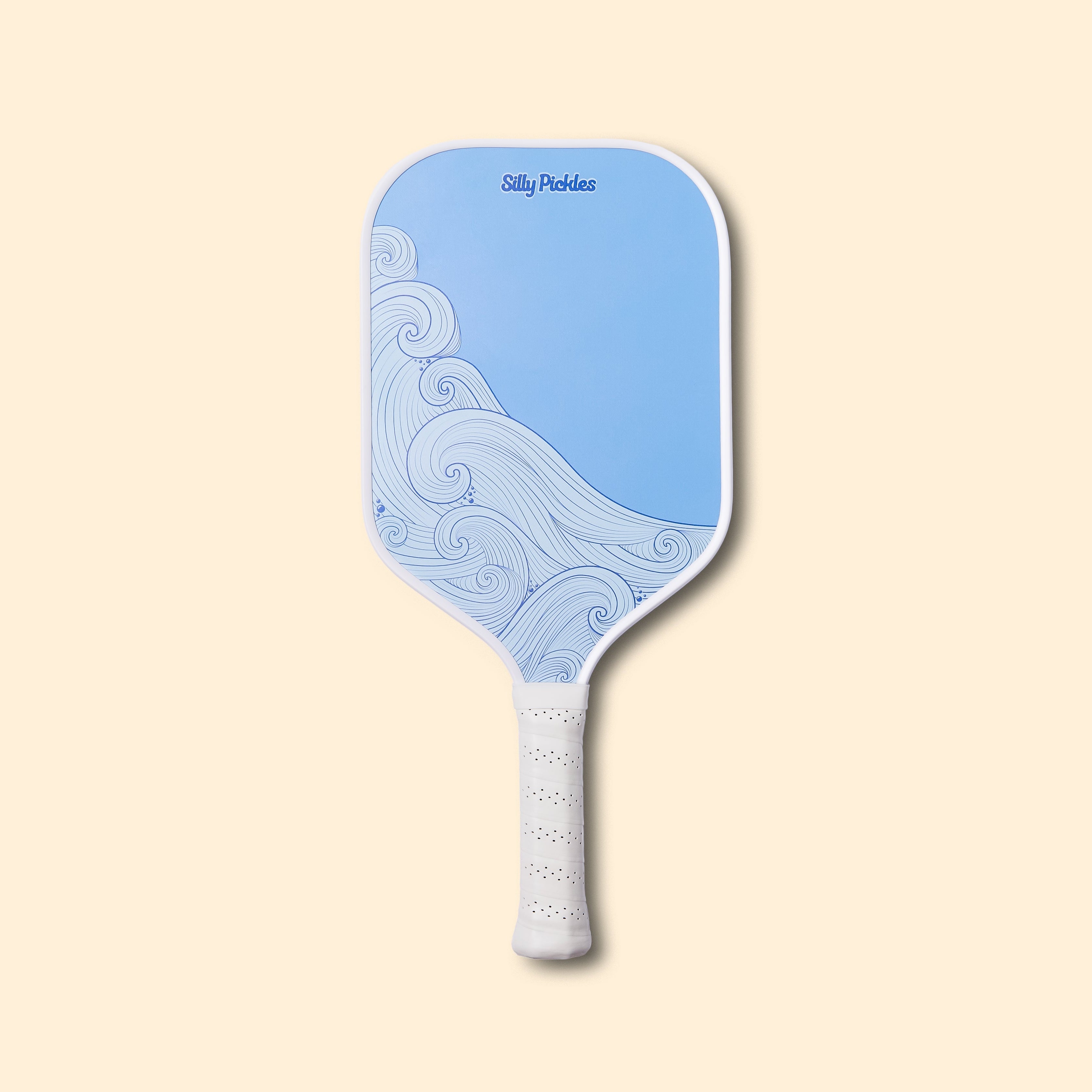 Silly Pickles pickleball paddle with wave design on a beige background